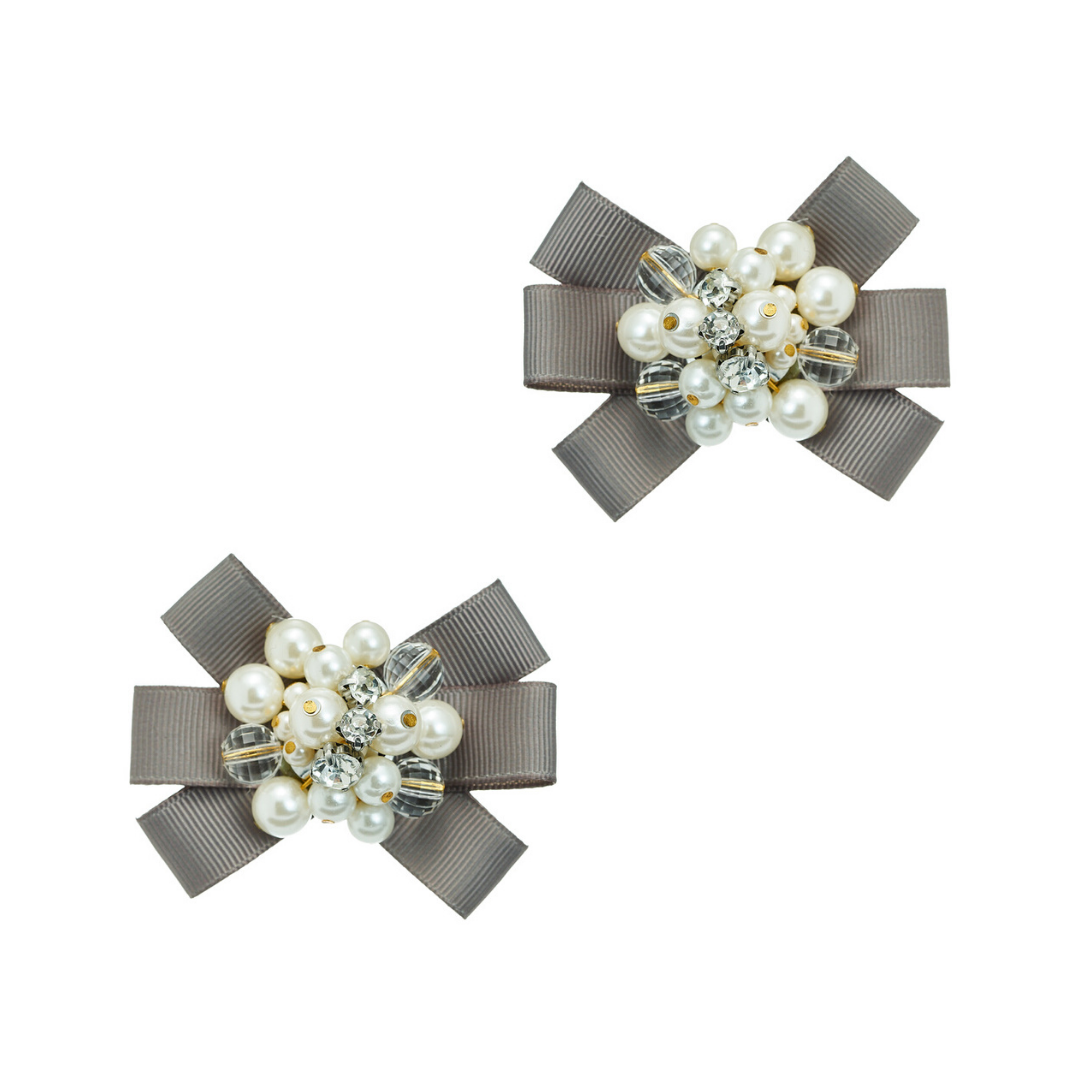 Die Romantik Schuhclips Wien zaubern mit kleinen Schleifen und Kunstperlen den besonderen Charme Wiens auf Ihre Schuhe.